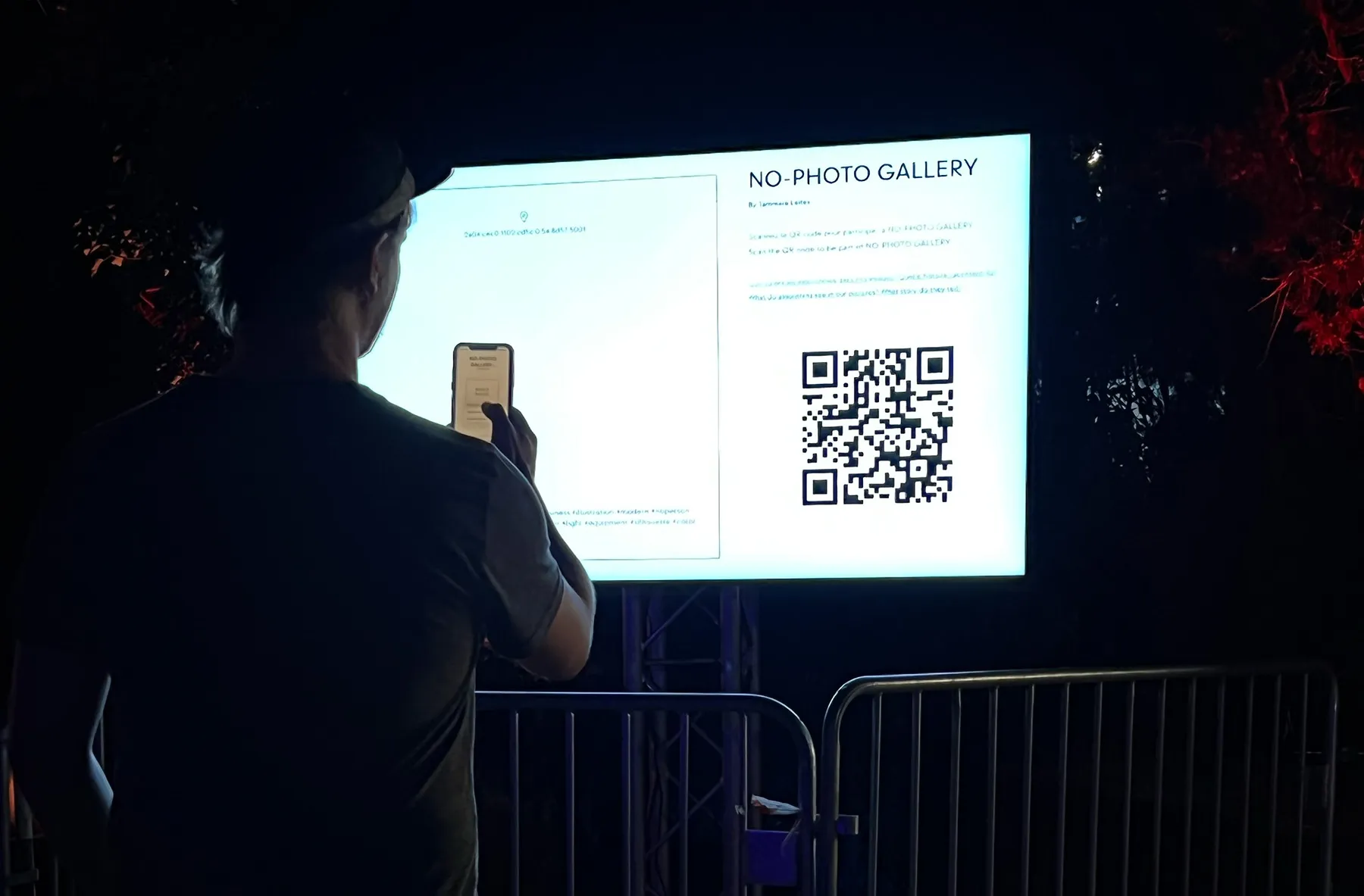 Visitor interacting with the NO-PHOTO GALLERY installation at Rencontres de la Photographie d'Arles.